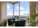 Cozy living room area with floor-to-ceiling windows and city views at 855 Peachtree St # 2901, Atlanta, GA 30308