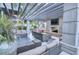 A furnished outdoor lounge area featuring a fireplace and television at 855 Peachtree St # 2901, Atlanta, GA 30308