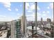 Stunning city views from dining area with floor-to-ceiling windows at 855 Peachtree St # 2901, Atlanta, GA 30308