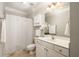 This bathroom has great lighting, white cabinets and modern fixtures at 1225 Westchester Ne Rdg, Atlanta, GA 30329
