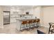 Modern kitchen features granite countertops, a stainless steel refrigerator, and a breakfast bar with seating at 1225 Westchester Ne Rdg, Atlanta, GA 30329