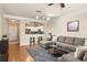 Open-concept living room with hardwood floors, a breakfast bar, and comfortable seating at 1225 Westchester Ne Rdg, Atlanta, GA 30329