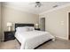 Serene main bedroom featuring plush carpeting, a ceiling fan, and en-suite bathroom access at 1225 Westchester Ne Rdg, Atlanta, GA 30329