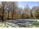 Well-maintained community tennis court with new nets, surrounded by lush trees, offering a private playing experience at 1225 Westchester Ne Rdg, Atlanta, GA 30329