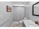 Bathroom featuring gray walls, a patterned shower curtain and gray vanity at 2375 Justine Ter, Lithia Springs, GA 30122
