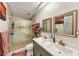 Bathroom featuring dual sinks, shower, and decor at 2375 Justine Ter, Lithia Springs, GA 30122