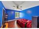 Bright bedroom with wooden floors, ceiling fan, and window letting in natural light at 2375 Justine Ter, Lithia Springs, GA 30122