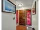 Entryway with hardwood floors, dark wood door, and complementary artwork on the walls at 2375 Justine Ter, Lithia Springs, GA 30122
