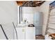 Functional laundry room with washer, dryer, and exposed plumbing for easy maintenance at 2375 Justine Ter, Lithia Springs, GA 30122