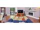 Cozy living area featuring hardwood floors, a fireplace, and a view of the outdoor deck at 2375 Justine Ter, Lithia Springs, GA 30122