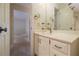 Bathroom featuring a single sink vanity and yellow wallpaper at 405 Putting Green Ln, Roswell, GA 30076