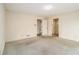 Neutral bedroom with carpet flooring and access to bathrooms and hallways at 405 Putting Green Ln, Roswell, GA 30076