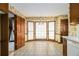 Bright breakfast nook featuring a bay window, tiled floors, and traditional wallpaper at 405 Putting Green Ln, Roswell, GA 30076