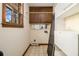 Storage room featuring open shelving and a window for natural light at 405 Putting Green Ln, Roswell, GA 30076