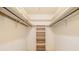 Spacious walk-in closet with built-in shelving for optimal storage and organization at 405 Putting Green Ln, Roswell, GA 30076