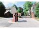 Gated community entrance with landscaped grounds, ensuring privacy and security at 789 Celeste Sw Ln, Atlanta, GA 30331