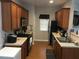 Well-lit kitchen featuring wood cabinets, stainless steel appliances, and a practical layout for cooking and meal preparation at 789 Celeste Sw Ln, Atlanta, GA 30331