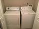 Laundry room featuring a washer and dryer, offering the convenience of doing laundry at home at 789 Celeste Sw Ln, Atlanta, GA 30331