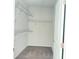 Walk-in closet offering built-in shelving for organized storage at 1649 Auburn Ridge Way, Dacula, GA 30019