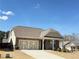 Charming home featuring a two-car garage, stone accents, and manicured landscaping at 1649 Auburn Ridge Way, Dacula, GA 30019