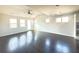 Bright, open living room featuring hardwood floors and abundant natural light at 1649 Auburn Ridge Way, Dacula, GA 30019