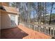 Wood back deck overlooking a wooded backyard and view of the neighborhood at 606 Wedgewood Dr, Woodstock, GA 30189