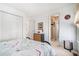 Bright bedroom with a double door closet and an adjacent bathroom entrance at 606 Wedgewood Dr, Woodstock, GA 30189