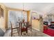 Cozy breakfast nook with wooden table set adjacent to living area and windows at 606 Wedgewood Dr, Woodstock, GA 30189