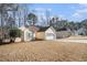 Inviting single-story home with a two-car garage and a well-manicured lawn on a sunny day at 606 Wedgewood Dr, Woodstock, GA 30189