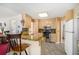 Well-lit kitchen featuring light wood cabinetry and stainless steel appliances at 606 Wedgewood Dr, Woodstock, GA 30189