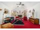 Spacious living room with vaulted ceiling, fireplace, and windows overlooking the backyard at 606 Wedgewood Dr, Woodstock, GA 30189