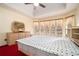 Spacious main bedroom featuring large windows that provide ample natural light at 606 Wedgewood Dr, Woodstock, GA 30189