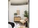 Charming bedroom decor featuring a stylish cabinet, a comfortable chair, and decorative plants, perfect for relaxation at 791 Wylie Se St # 105, Atlanta, GA 30316
