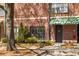 Charming building facade with lush landscaping and mature trees, blending seamlessly with the natural surroundings at 791 Wylie Se St # 105, Atlanta, GA 30316