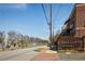 Charming brick building with a brick sign, beautifully landscaped with colorful flowers and greenery at 791 Wylie Se St # 105, Atlanta, GA 30316