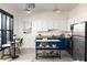 Modern kitchen with white cabinets, blue lower cabinets, stainless steel appliances and a kitchen island at 791 Wylie Se St # 105, Atlanta, GA 30316