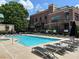 Serene pool area with lounge chairs, umbrellas, and lush landscaping creating a relaxing atmosphere at 791 Wylie Se St # 105, Atlanta, GA 30316