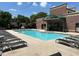 Community pool featuring lounge seating, with a well maintained brick building visible at 791 Wylie Se St # 105, Atlanta, GA 30316