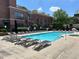 Inviting community pool area with lounge chairs and well-manicured landscaping on a sunny day at 791 Wylie Se St # 105, Atlanta, GA 30316