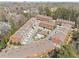 Aerial view of townhome community featuring a pool, landscaping, and charming architectural details at 2934 Hermance Ne Dr, Atlanta, GA 30319