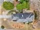 Aerial view showcasing the home's roof, surrounding trees and paved driveway at 3605 Summit Gate Dr, Suwanee, GA 30024