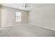 Bedroom featuring plush carpet, ceiling fan, and plenty of natural light at 3605 Summit Gate Dr, Suwanee, GA 30024