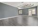 Spacious bedroom featuring gray walls, modern ceiling fan, and access to the outdoors at 3605 Summit Gate Dr, Suwanee, GA 30024