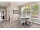 Bright breakfast nook features a table for four and large windows overlooking greenery at 3605 Summit Gate Dr, Suwanee, GA 30024