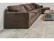 Comfortable living room showcasing a large sofa and side table on gray carpet at 3605 Summit Gate Dr, Suwanee, GA 30024