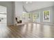 Spacious living room with fireplace and French doors providing ample natural light at 3605 Summit Gate Dr, Suwanee, GA 30024