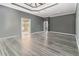 Spacious main bedroom featuring tray ceilings, neutral walls, and ensuite bathroom access at 3605 Summit Gate Dr, Suwanee, GA 30024