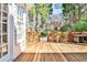 Wooden back deck with decorative wood railings with a clear view of a beautiful yard at 4537 Rutherford Dr, Marietta, GA 30062