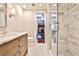 Elegant bathroom featuring white marble shower, wooden cabinets, and decorative tile flooring at 4537 Rutherford Dr, Marietta, GA 30062