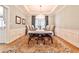 Formal dining room featuring a large table, elegant chandelier, and classic wainscoting at 4537 Rutherford Dr, Marietta, GA 30062